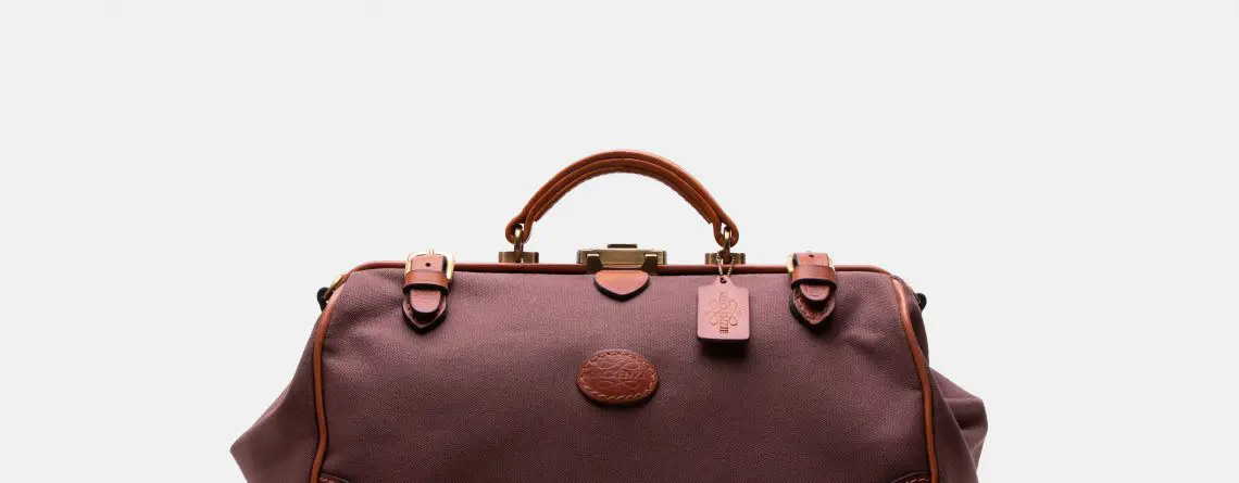 Waterproof travel bag in canvas & leather brown, handmade by Mackenzie Leather Edinburgh.