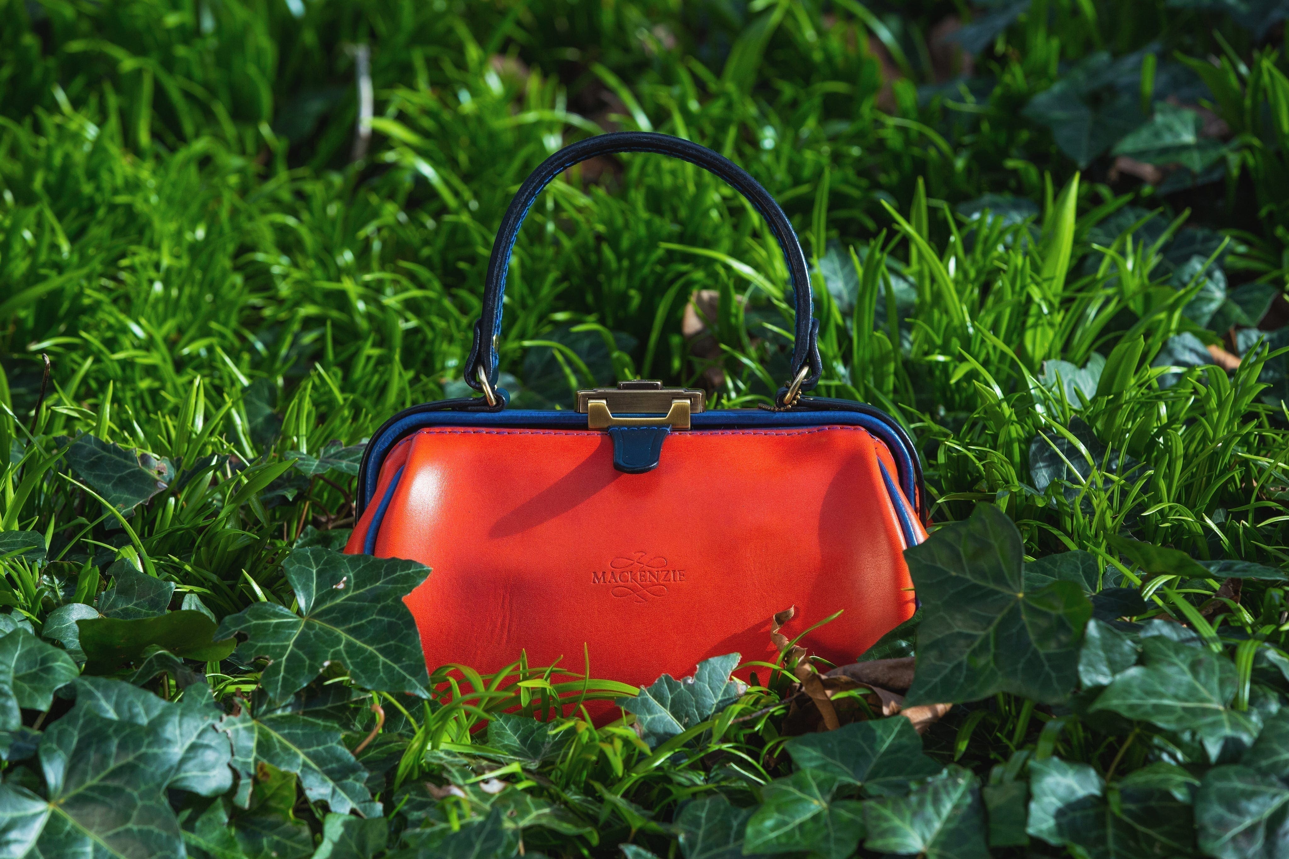 Gladstonette, leather shoulder & handbag, a classic British design in Italian soft hide festival orange leather, handmade by Mackenzie Leather Edinburgh.